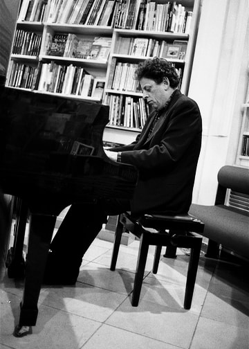 Philip Glass playing the piano.