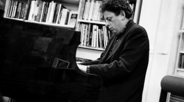 Philip Glass playing the piano.