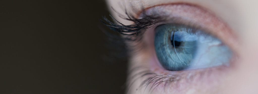 Photo by Sean Brown. Close up photo of a blue eye.