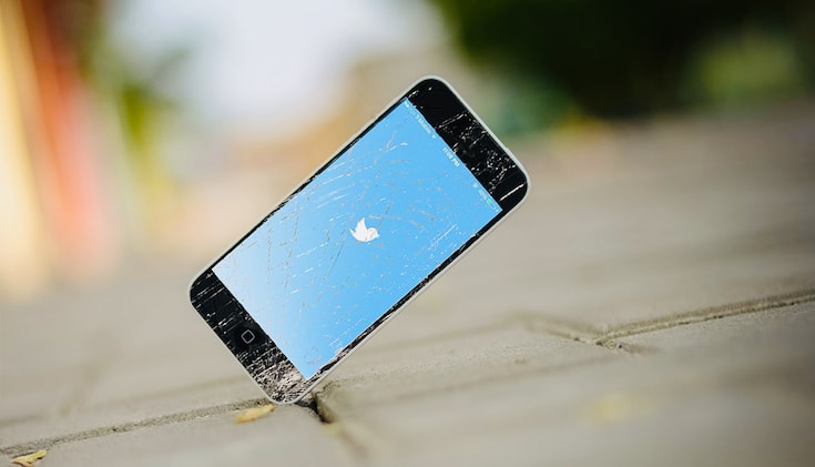 iPhone smashing on ground, with Twitter open