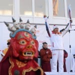 Dharma meets sports: U.S.-born Mongolian lama carries Olympic flame