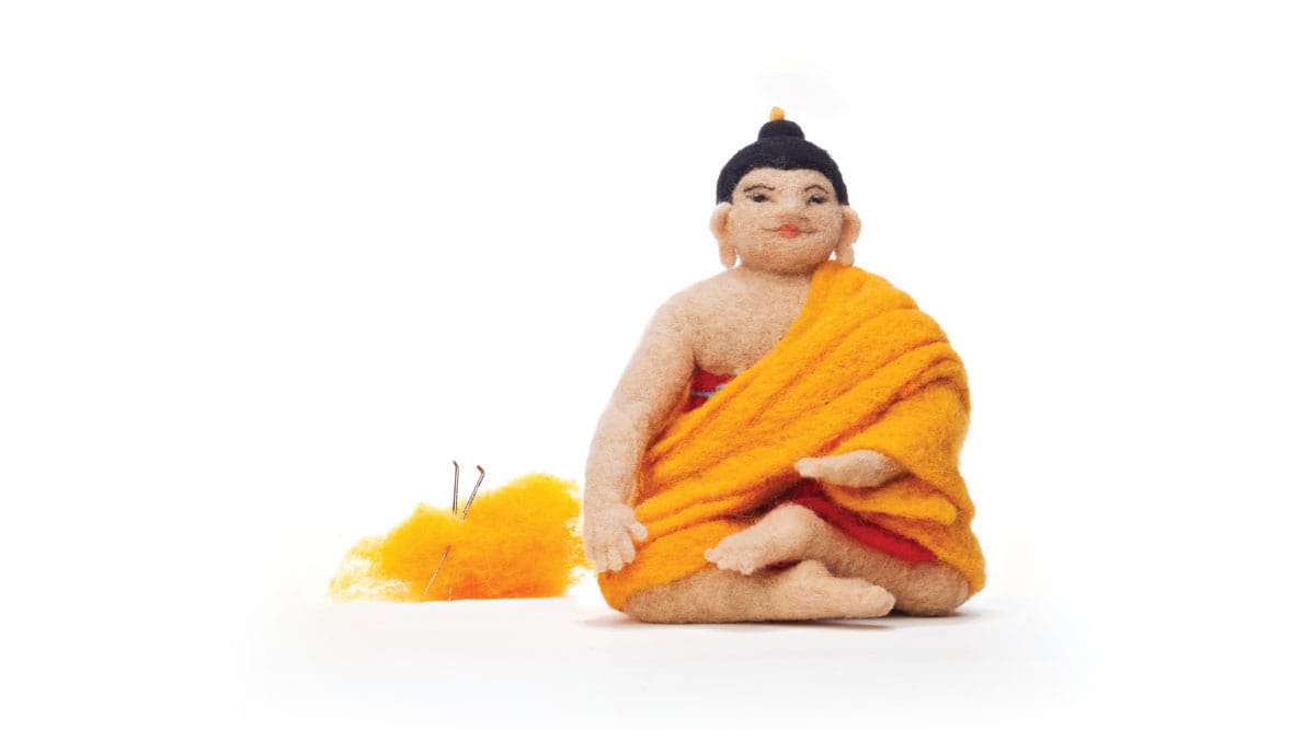 A felt Buddha statue.
