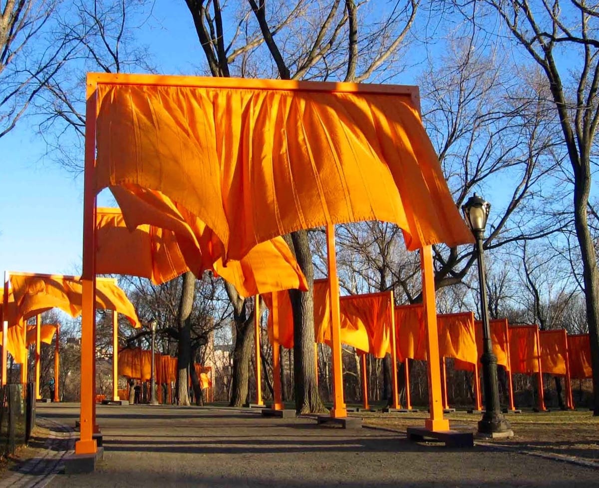 The gates. The poles are all orange with orange sheet-like things attached to the top, floating in the wind.