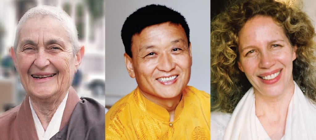 A photo of three people smiling.
