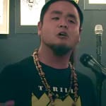 In this mic-dropping poetry slam, George Yamazawa out-logics slurs with Buddhism