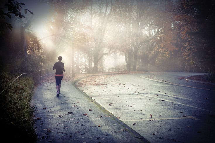 A runner in the fog.