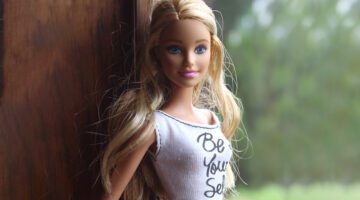 Barbie wears a shirt that says "be yourself"