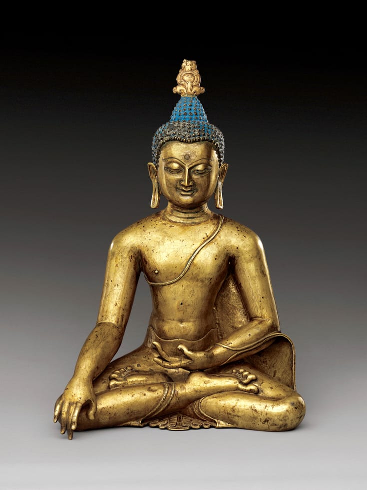 Tibetan sculpture of Shakyamuni Buddha sitting and touching the earth.