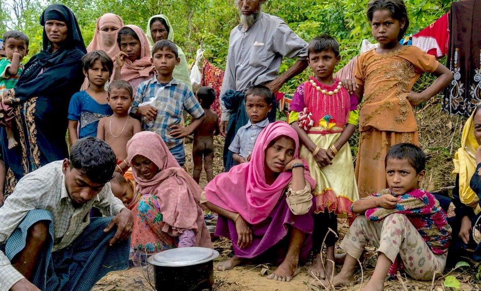Rohingya family on the side of the road.