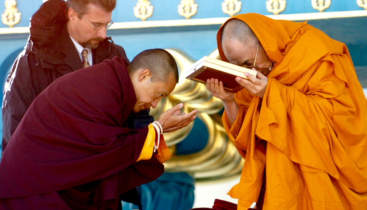 Sakyong Mipham presenting an award to the Dalai Lama