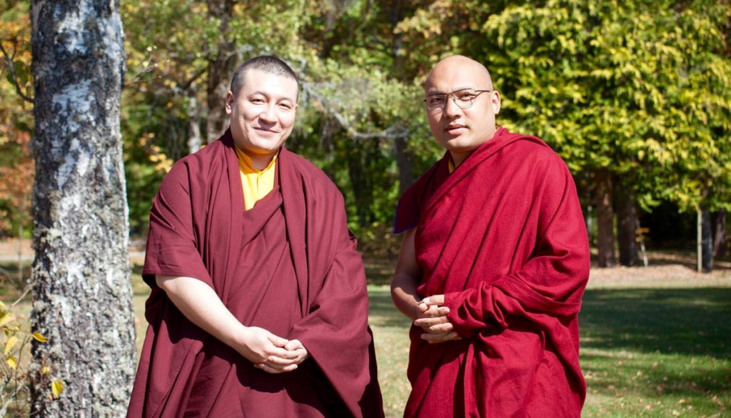 The two Karmapas standing next to each other.