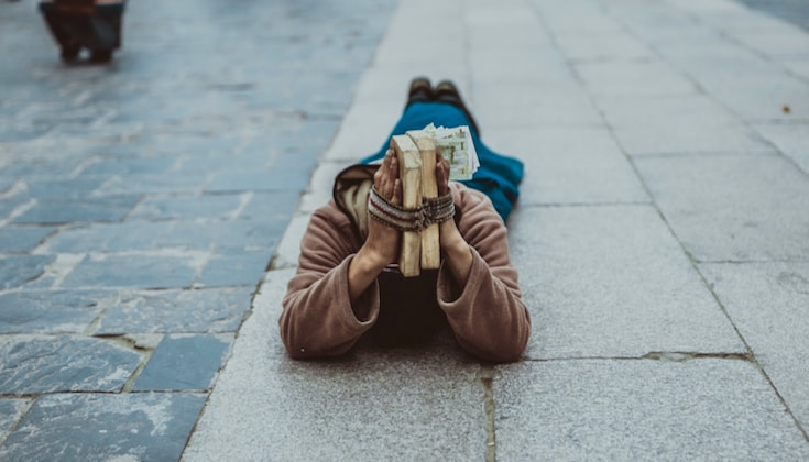 Person prostrating in the street