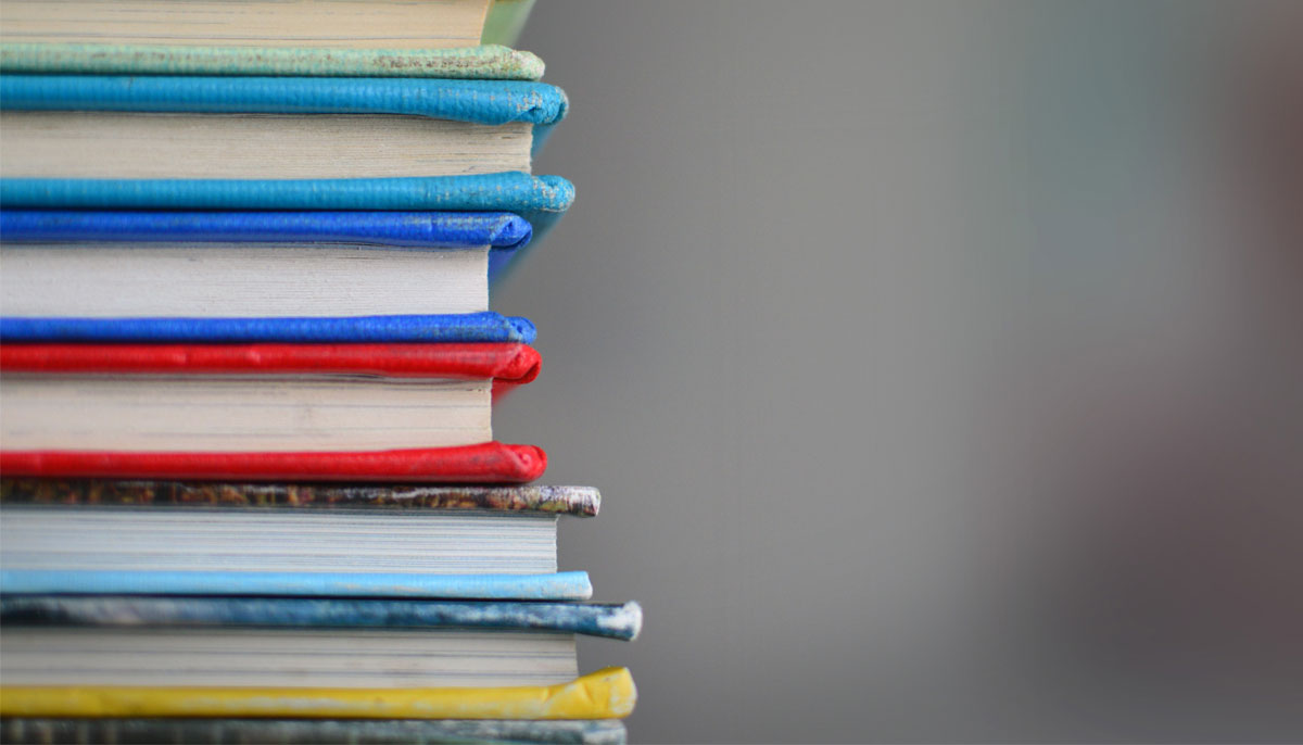 A close up photo on a stack of books.