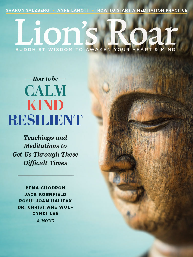Cover of July 2020 magazine. There is a wooden Buddhist statue looking sideways against a blue background.