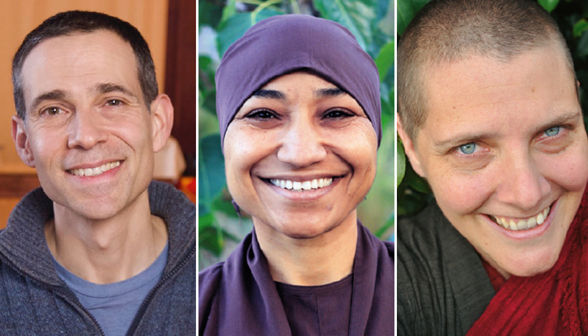 A photo of three people. The man on the left is smiling and wearing a grey sweater and blue shirt. The woman in the middle is smiling and wearing a purple shirt. The woman on the right is smiling at the camera.