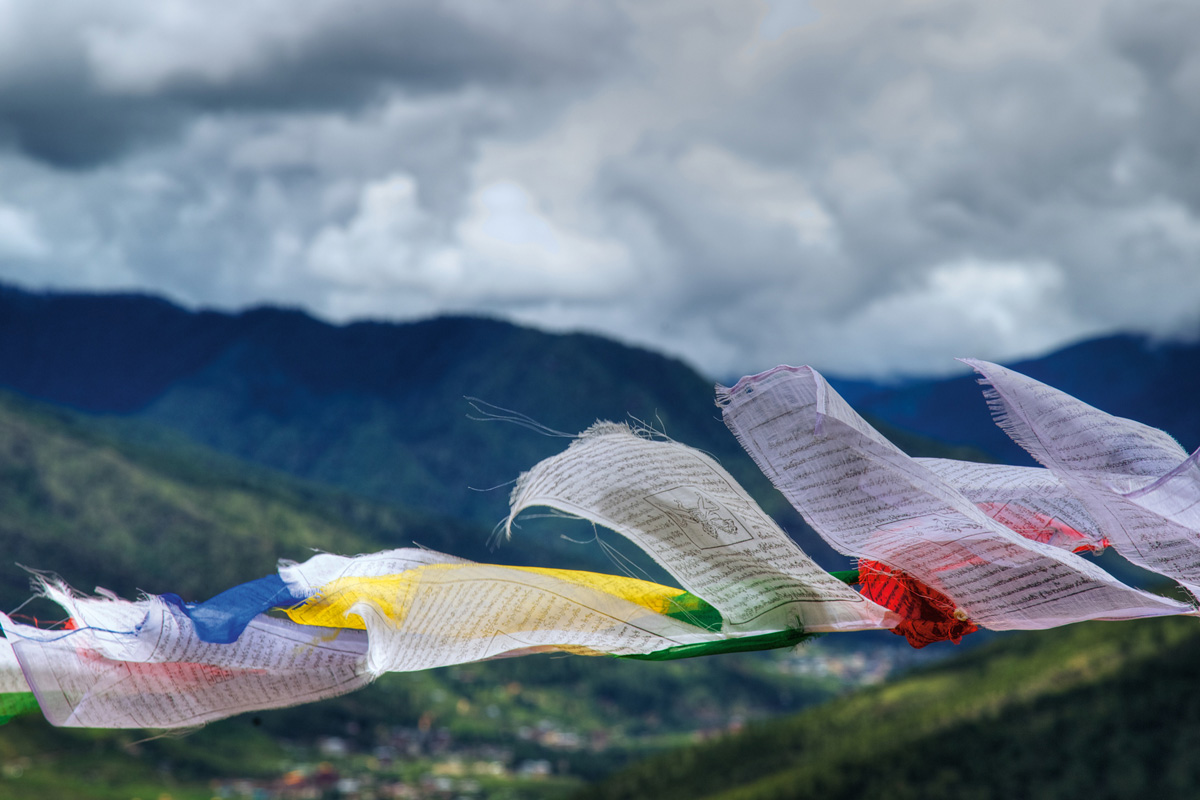 A bunch of papers covered in writing on a clothesline.