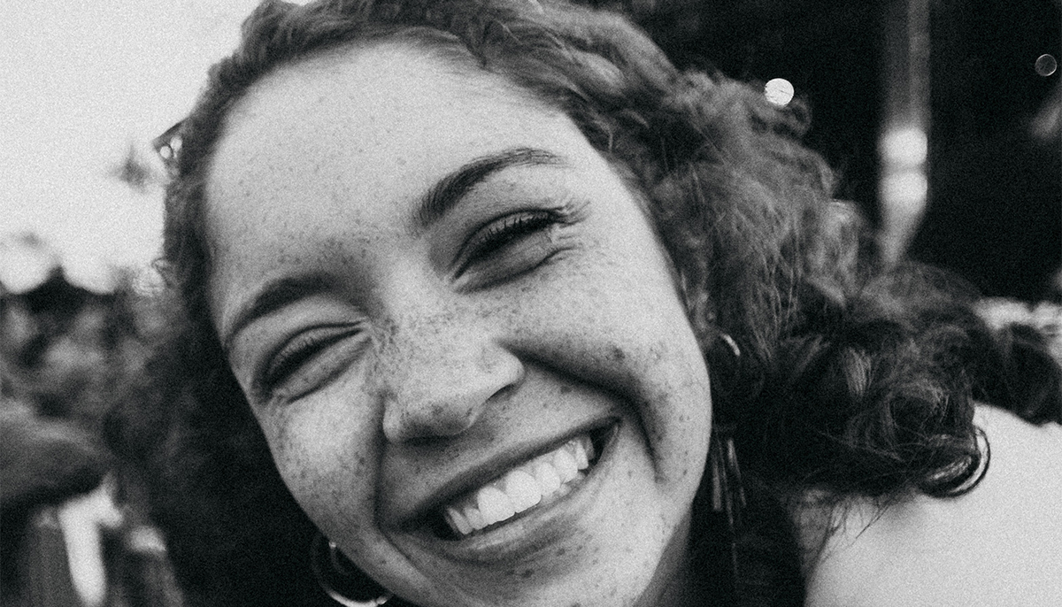 Woman smiling.