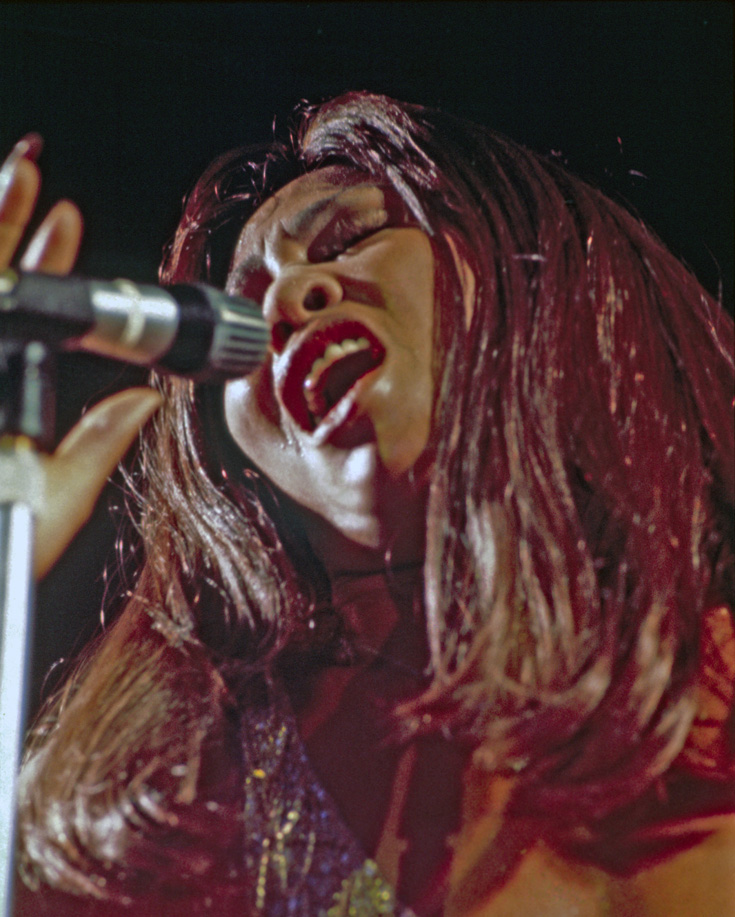 Tina Turner, dressed in a gold beaded dress, performs at the Musikhalle Hamburg in November 1972.