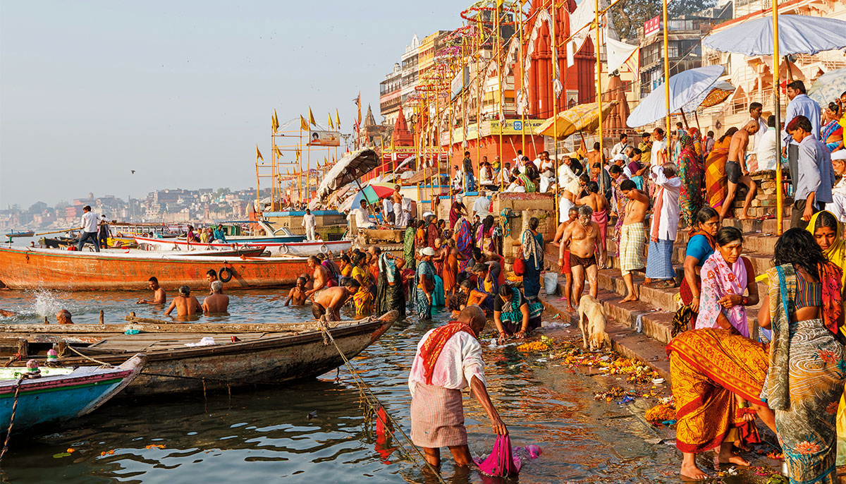 Peole in Varanasi, India, people bathing in the Ganges.