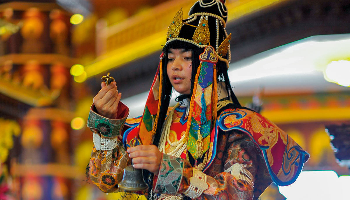 A nun dressed in traditional outfit performs a sacred dance