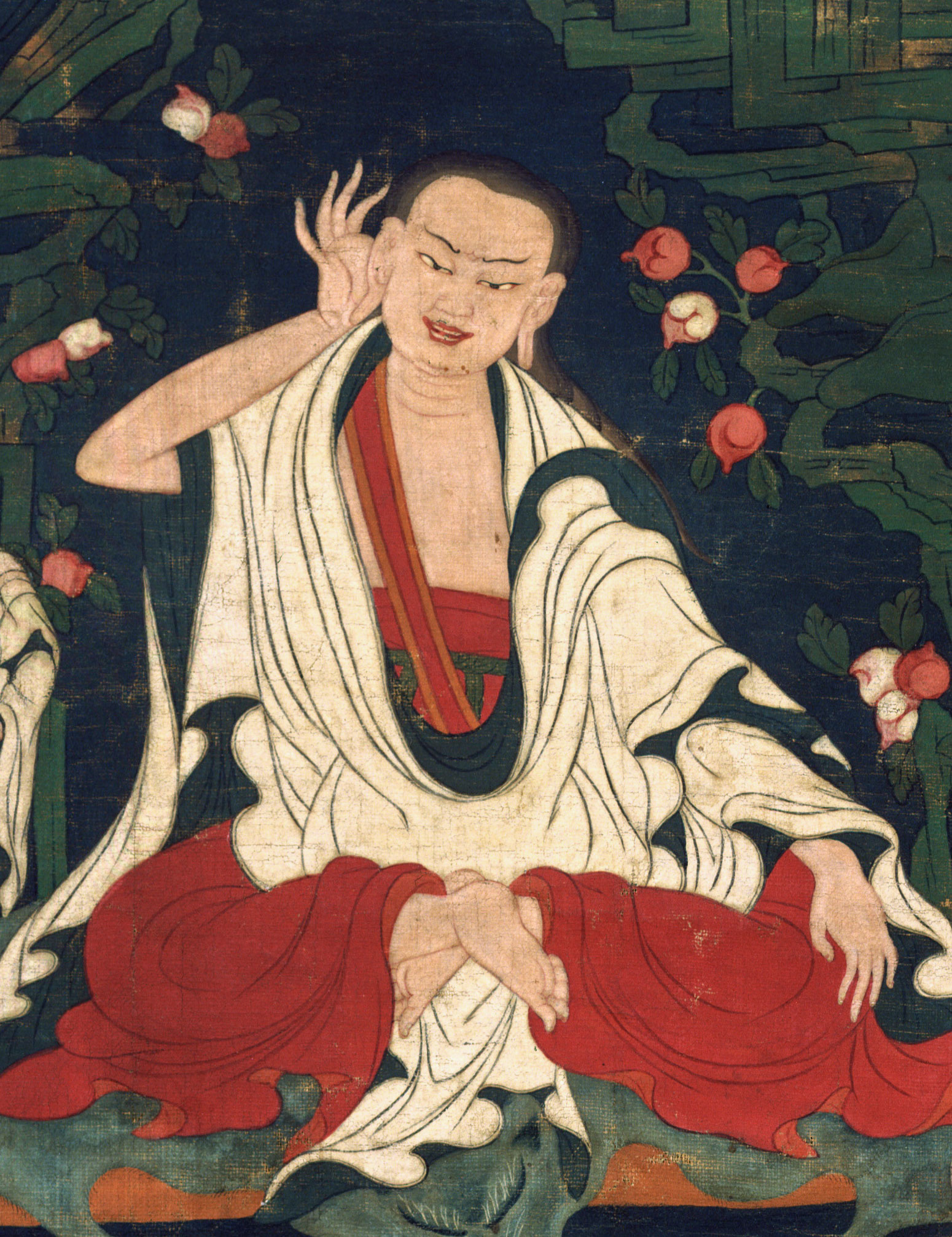 An artwork depicts Milarepa seated in full lotus posture in red robes with one hand to his ear.