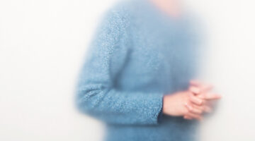 Photo by Ann Hamilton of man in blue sweater.