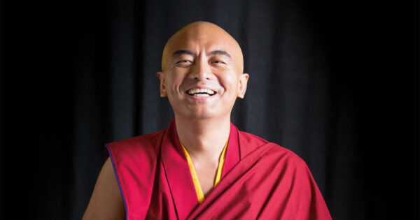 Mingyur Rinpoche smiling at camera.