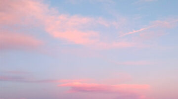 Pink clouds in blue sky