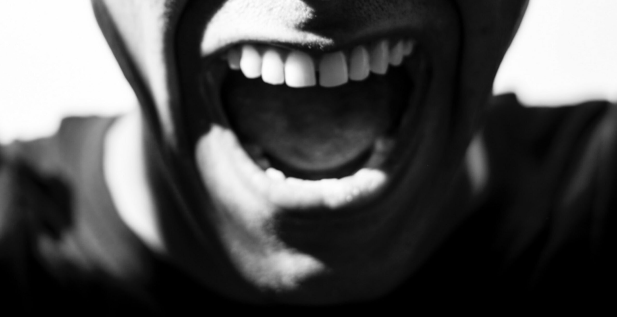 Black and white illustration of person yelling